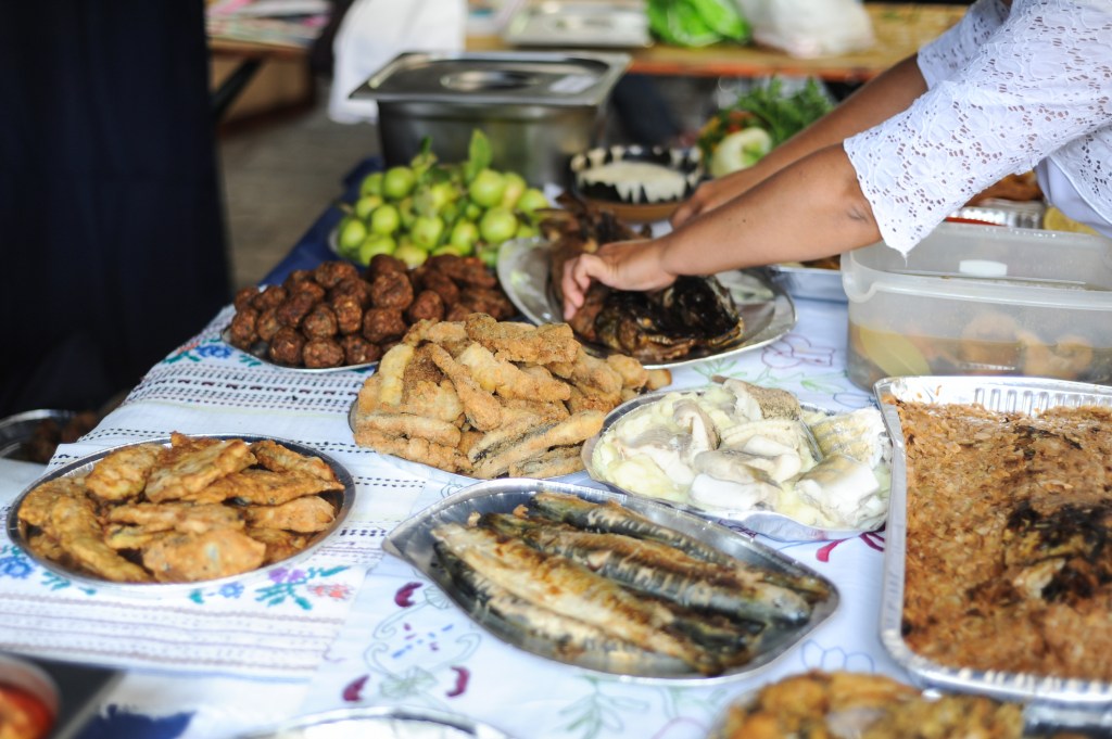 Traditional fish meal in the Danube Delta, Romania, with multiple dishes on a decorated table
