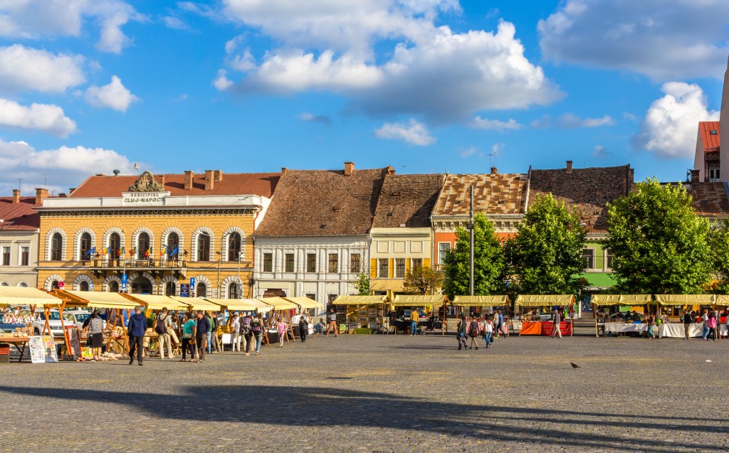 Unirii (Union) Square on a market day. The city has been gathering here since the Middle Ages.