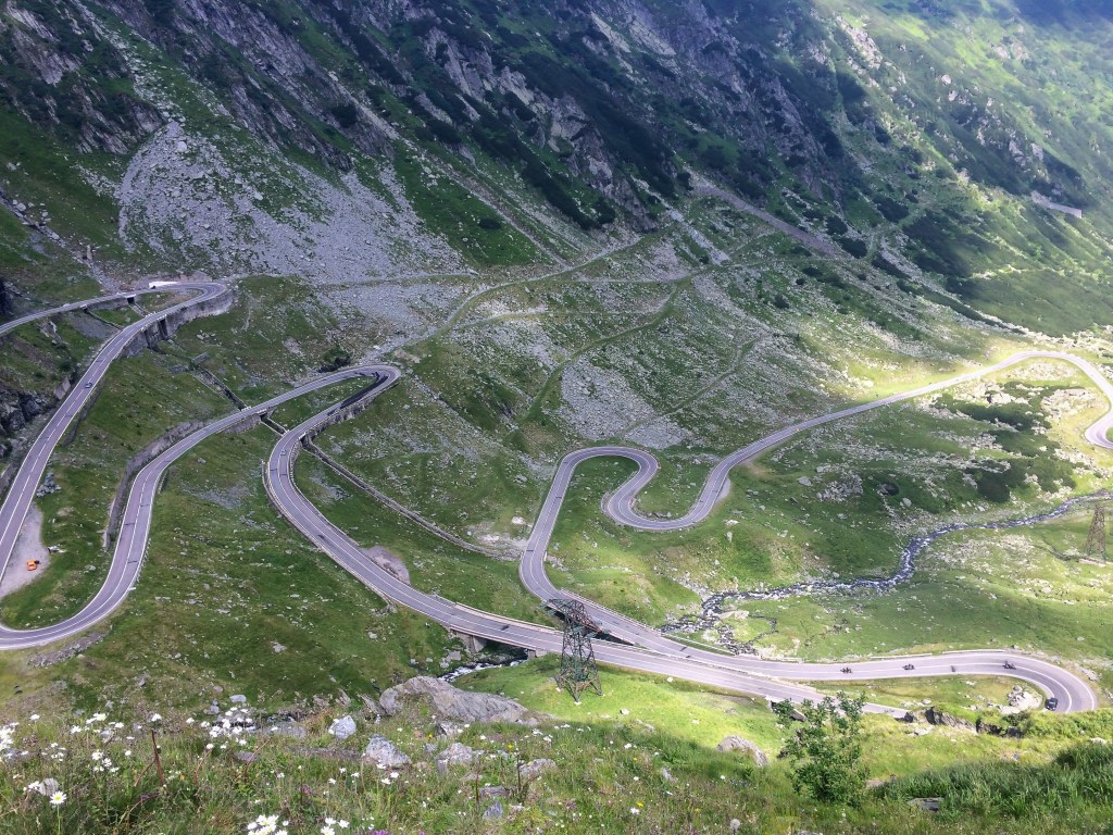Aerial view of the winding hairpin turns of the Transfăgărășan road in Romania.