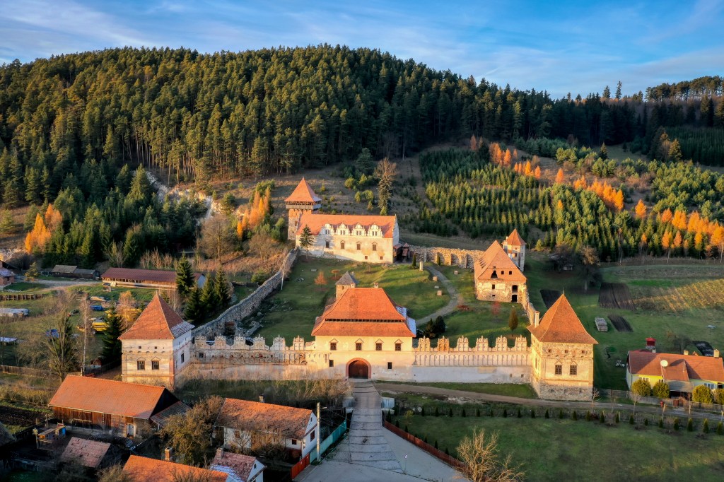 Aerial autumn view of Lázár Castle in Lăzarea, Harghita County.