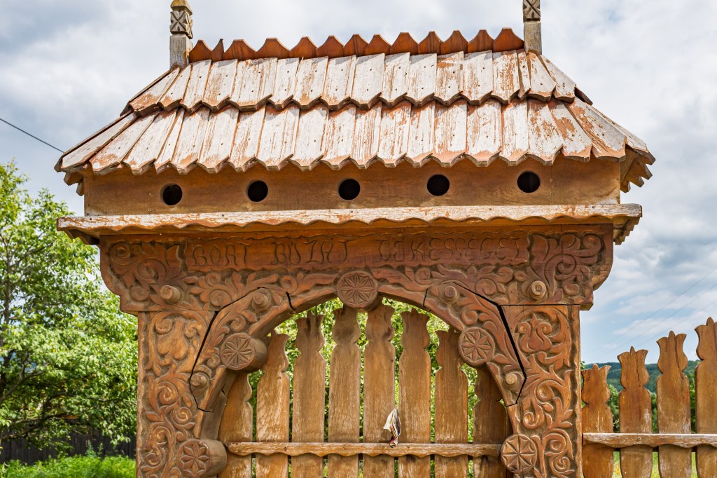 A traditional Székely gate, Transylvania, Romania, hand-carved wood, a symbol of Székely cultural identity.